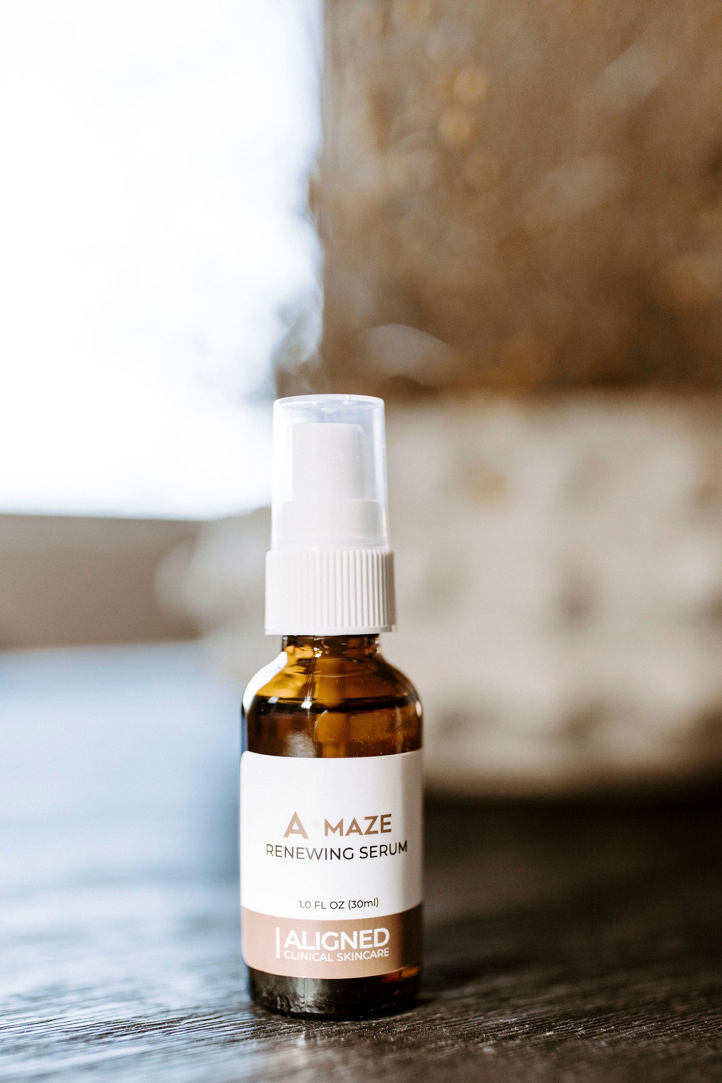 A-maze Renewing Serum in amber glass pump bottle