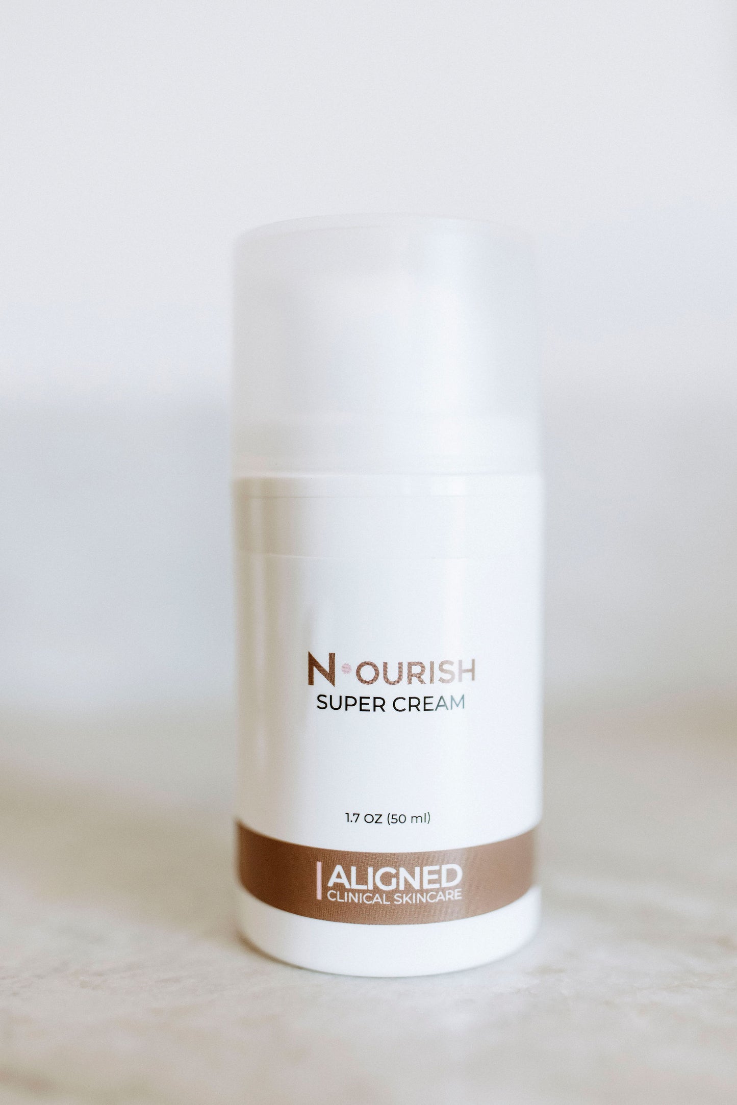 Nourish Super Cream in white pump bottle