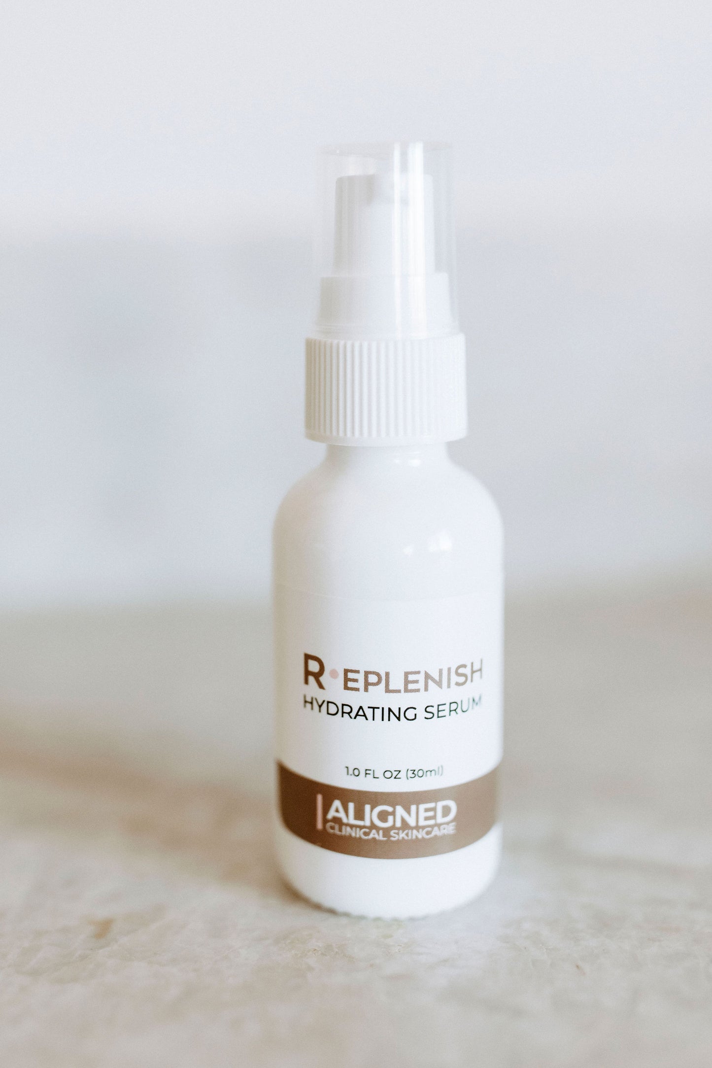 Replenish Hydrating Serum in white spray bottle