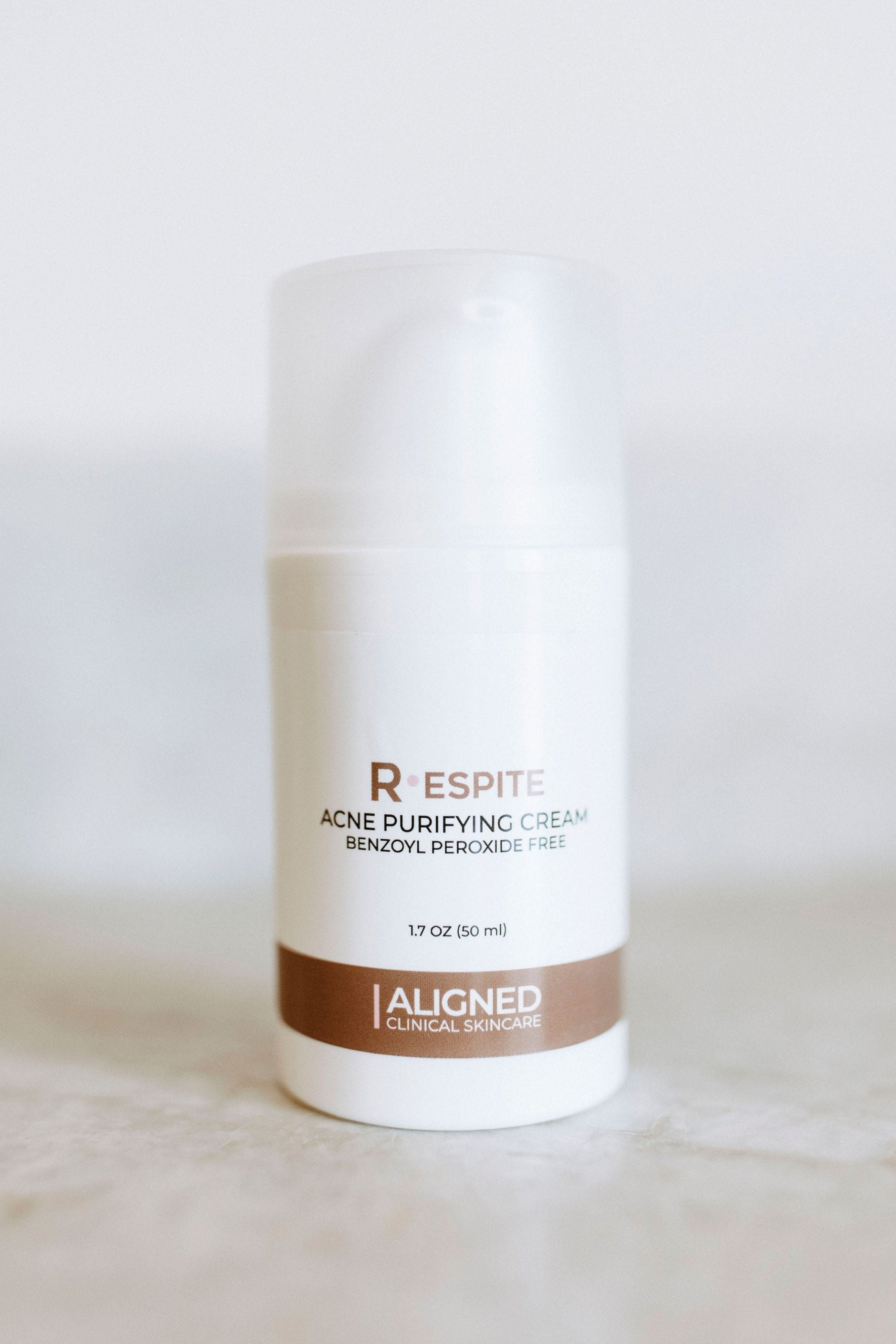 Respite Acne Purifying Cream in white pump 